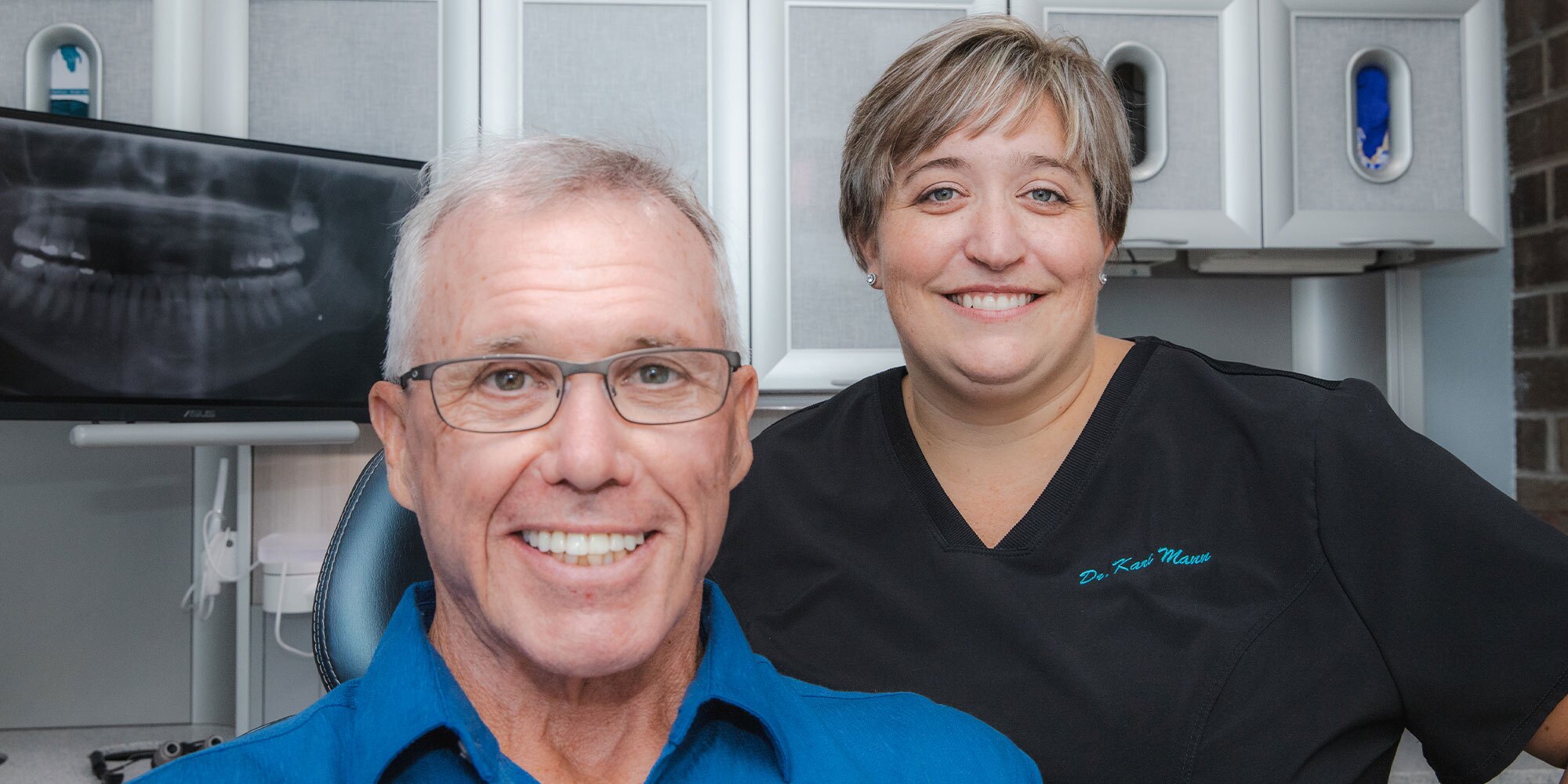 Dr. Kari Mann with dental implant patient after final restoration