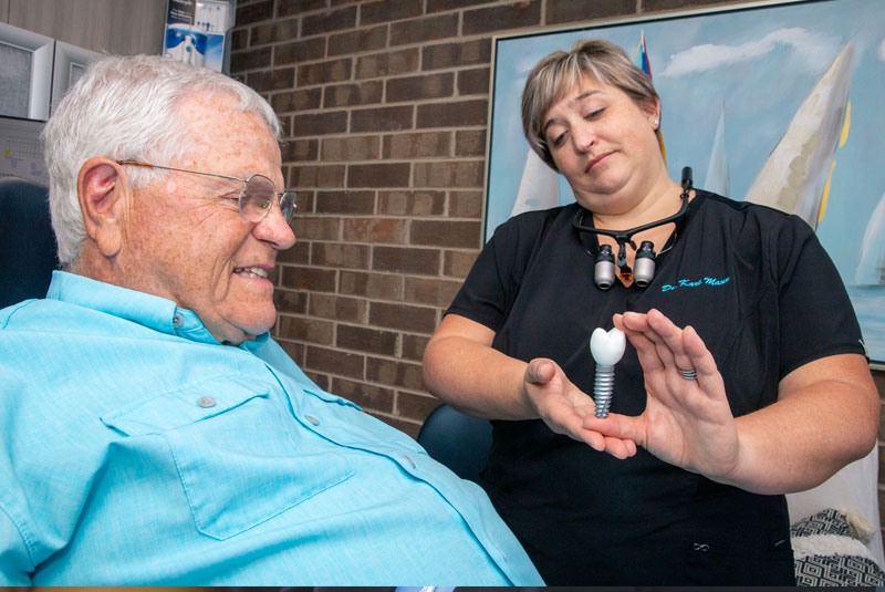 dr kari mann showing implant to alan