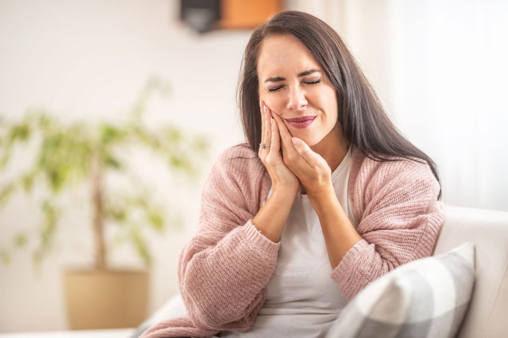 Sick woman with tooth pain