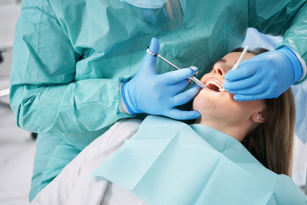 Woman receiving dental sedation in dentist office